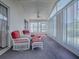 Enclosed lanai with furniture and great natural light at 712 Old Oaks Ln, Leesburg, FL 34748