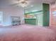 Cozy living room area features pink carpet and natural light from adjacent rooms at 712 Old Oaks Ln, Leesburg, FL 34748