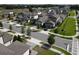 New construction homes line a street with sidewalks, landscaping, and attached garages in a suburban planned community at 7955 Delwin Ln, Reunion, FL 34747