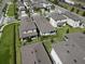 Manicured lawns and mature landscaping surround new construction homes in a planned community at 7955 Delwin Ln, Reunion, FL 34747