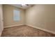 Neutral bedroom with carpeting, a ceiling fan, a window with blinds and a closet at 7955 Delwin Ln, Reunion, FL 34747