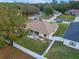 An aerial backyard shot with fenced yard and a patio set at 847 Cumberland Cir, Minneola, FL 34715