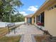Paver patio with BBQ and seating in a fenced backyard at 847 Cumberland Cir, Minneola, FL 34715