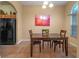 Cozy breakfast nook with dark wood table and chairs at 847 Cumberland Cir, Minneola, FL 34715