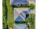 An aerial view of the home's roof, landscaping, and surrounding lawn space at 8601 Se 133Rd St, Summerfield, FL 34491