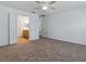 Bedroom with neutral walls, carpet flooring, and double doors leading to the bathroom and walk-in closet at 8601 Se 133Rd St, Summerfield, FL 34491