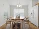 Dining area with table, chairs, and a light-filled window at 8601 Se 133Rd St, Summerfield, FL 34491