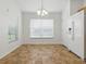 Bright dining area featuring a window and white refrigerator at 8601 Se 133Rd St, Summerfield, FL 34491