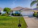 Beautiful home with well-maintained landscaping and a spacious two-car garage at 8601 Se 133Rd St, Summerfield, FL 34491