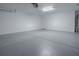Spacious two car garage with white painted walls and sealed concrete floors at 8601 Se 133Rd St, Summerfield, FL 34491