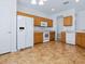 Spacious kitchen with white appliances and light wood cabinets at 8601 Se 133Rd St, Summerfield, FL 34491