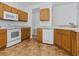 Bright kitchen with white appliances and light wood cabinets at 8601 Se 133Rd St, Summerfield, FL 34491
