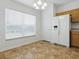 Eat-in kitchen area with light-filled window and white refrigerator at 8601 Se 133Rd St, Summerfield, FL 34491