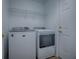 Well-equipped laundry room with a Maytag washer and dryer and wire shelving for storage at 8601 Se 133Rd St, Summerfield, FL 34491