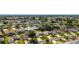 Community aerial shot showcasing well-maintained homes with mature trees at 965 Eastmont Ct, The Villages, FL 32162