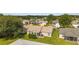 Aerial view of backyard with a cozy patio and well-maintained lawn at 965 Eastmont Ct, The Villages, FL 32162
