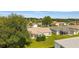 Aerial view of backyard with a cozy patio and well-maintained lawn at 965 Eastmont Ct, The Villages, FL 32162