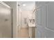 Well-lit bathroom featuring a glass-enclosed shower and tile flooring at 965 Eastmont Ct, The Villages, FL 32162