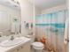 Lovely bathroom decorated with beach-themed accents and a shower curtain at 965 Eastmont Ct, The Villages, FL 32162