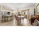 Open floor plan with kitchen, dining area, and lanai access at 965 Eastmont Ct, The Villages, FL 32162