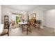 Cozy dining area with chandelier and sliding glass doors to the lanai at 965 Eastmont Ct, The Villages, FL 32162