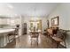 Bright dining area with marble table and easy access to kitchen and lanai at 965 Eastmont Ct, The Villages, FL 32162