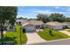 Inviting single-story home with a cozy patio and well-maintained lawn at 965 Eastmont Ct, The Villages, FL 32162