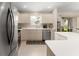Bright kitchen with stainless appliances, white countertops, and plenty of cabinet space at 965 Eastmont Ct, The Villages, FL 32162