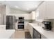 Efficient kitchen with stainless steel appliances and plenty of cabinet storage at 965 Eastmont Ct, The Villages, FL 32162