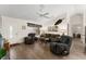 Living room featuring sleek wood floors and comfortable seating, creating an inviting atmosphere at 965 Eastmont Ct, The Villages, FL 32162