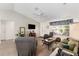 Bright living room with vaulted ceilings, ceiling fan, and comfortable seating arrangement at 965 Eastmont Ct, The Villages, FL 32162