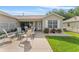 Relaxing patio with comfortable seating and lush landscaping, creating an inviting outdoor living space at 965 Eastmont Ct, The Villages, FL 32162