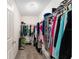 Walk-in closet with ample storage space and organization racks at 965 Eastmont Ct, The Villages, FL 32162