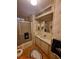 View of a full bathroom with a combination shower-tub, vanity and floral wallpaper at 1005 Matthew Ave, Lady Lake, FL 32159