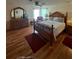 Bedroom featuring hardwood floors, ceiling fan, natural light, and furniture at 1005 Matthew Ave, Lady Lake, FL 32159
