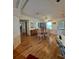 Open dining area with hardwood floors, a ceiling fan, and plenty of natural light and furniture at 1005 Matthew Ave, Lady Lake, FL 32159
