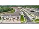 Aerial view of newly built townhomes featuring attached garages and sidewalks in a well-kept neighborhood at 1042 Lido Dr, Howey In The Hills, FL 34737