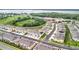 Aerial view of new townhomes in a community near a school and green space, offering a convenient location at 1042 Lido Dr, Howey In The Hills, FL 34737