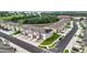 Aerial view of a neighborhood showcasing townhomes, manicured lawns, and tree-lined streets at 1042 Lido Dr, Howey In The Hills, FL 34737