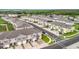 Aerial view of a residential community showcasing townhomes and well-maintained landscaping at 1042 Lido Dr, Howey In The Hills, FL 34737