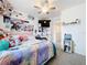 Bedroom featuring carpet, a ceiling fan, a TV, and toys at 1042 Lido Dr, Howey In The Hills, FL 34737