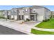 Charming townhomes featuring attached garages, manicured lawns, and neutral color schemes at 1042 Lido Dr, Howey In The Hills, FL 34737