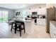 Stylish kitchen with granite countertops, stainless appliances, and center island that opens to living space at 1042 Lido Dr, Howey In The Hills, FL 34737
