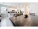 Open-concept kitchen and dining area with stainless appliances, white cabinetry, and modern finishes at 1042 Lido Dr, Howey In The Hills, FL 34737
