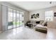 Bright living room with sliding glass doors leading to an outdoor patio, creating a seamless indoor-outdoor flow at 1042 Lido Dr, Howey In The Hills, FL 34737