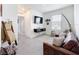 Cozy living room with a large window, a comfortable couch, and stylish decor at 1042 Lido Dr, Howey In The Hills, FL 34737