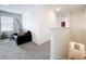 Upstairs landing with cozy seating offers a spot for relaxation or reading nook at 1042 Lido Dr, Howey In The Hills, FL 34737