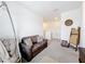 Upstairs living area with comfortable seating, plush pillows, and stylish decor at 1042 Lido Dr, Howey In The Hills, FL 34737