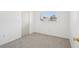 Cozy bedroom with neutral carpet, white walls, closet, and natural light at 11214 Sw 77Th Ct, Ocala, FL 34476