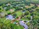 Aerial view of a luxury estate highlighting the expansive property and surrounding landscape at 11226 Lane Park Rd, Tavares, FL 32778